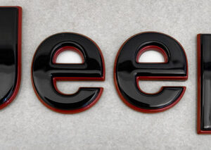 Mopar Black and Red Jeep Hood Badge for the 2022-2025 Grand Cherokee WL